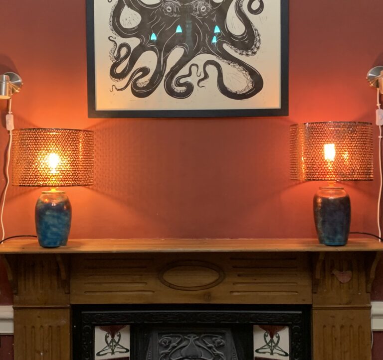 pair of copper lamps